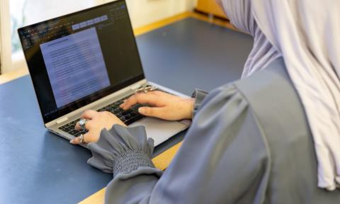 Student using a laptop.